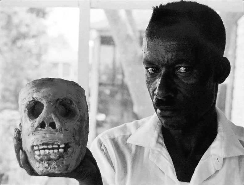BluesmanJames "Son Ford" Thomas with one of his clay skulls; pic: William Ferris